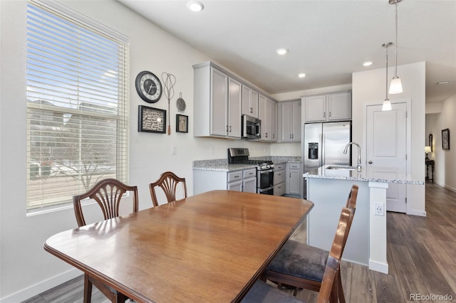 dining area featuring baseboards, dark wood-style flooring, and recessed lighting