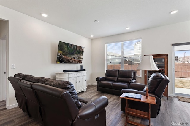 living area featuring recessed lighting, plenty of natural light, and wood finished floors