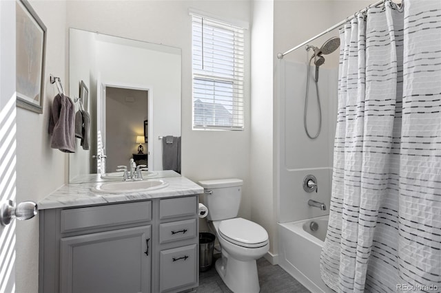 bathroom featuring toilet, shower / bath combination with curtain, and vanity