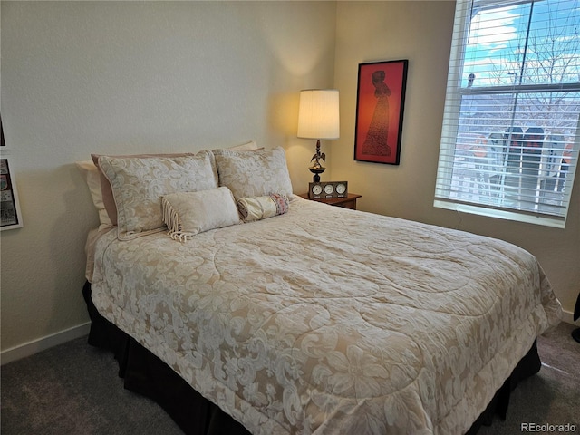 carpeted bedroom with baseboards