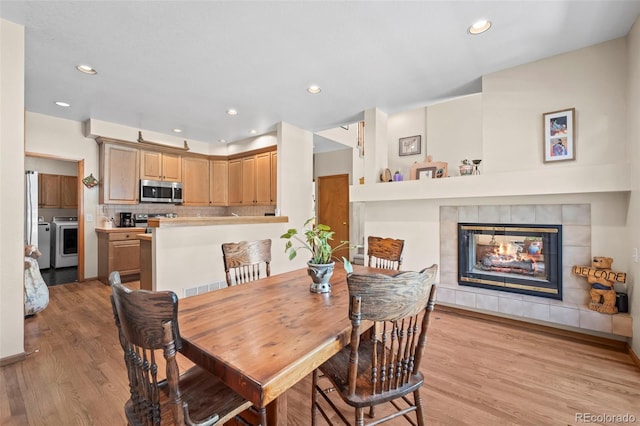 9869 Julian Way # B, Westminster, CO 80031 - dining space with light wood-style floors, recessed lighting, and a tile fireplace