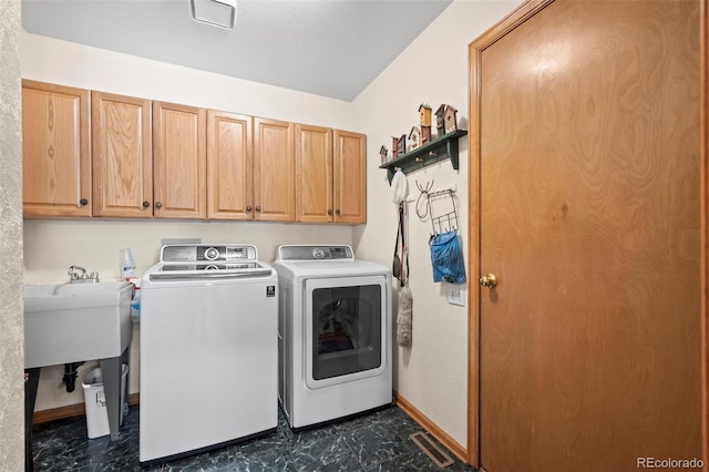 9869 Julian Way # B, Westminster, CO 80031 - washroom with cabinet space and washing machine and clothes dryer