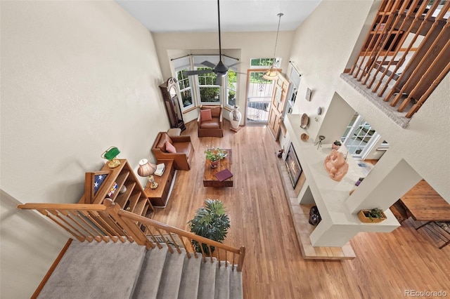 9869 Julian Way # B, Westminster, CO 80031 - stairway with a towering ceiling and wood finished floors