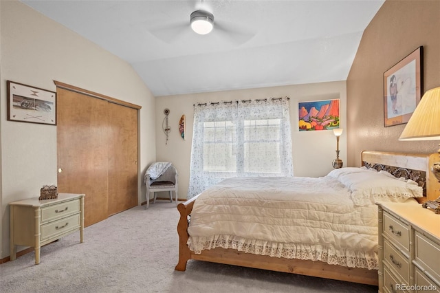 9869 Julian Way # B, Westminster, CO 80031 - bedroom featuring vaulted ceiling, light carpet, a closet, and a ceiling fan