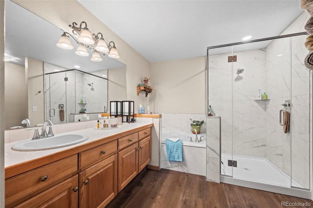 9869 Julian Way # B, Westminster, CO 80031 - bathroom featuring a bath, vanity, a marble finish shower, and wood finished floors
