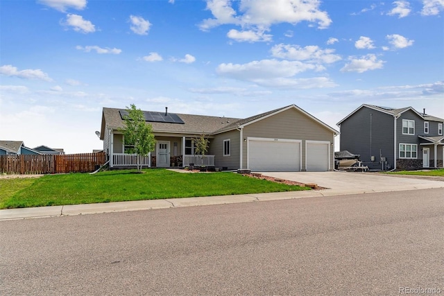 304 S 2nd Ave, Deer Trail, CO 80105 - view of front of property featuring an attached garage, solar panels, concrete driveway, covered porch, and a shingled roof
