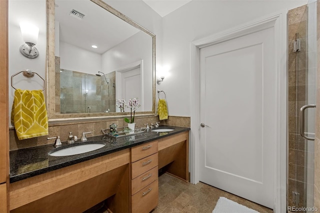 bathroom with vanity and walk in shower