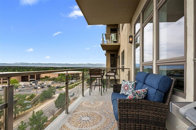 balcony featuring a mountain view