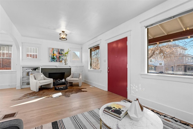 sitting room with hardwood / wood-style flooring