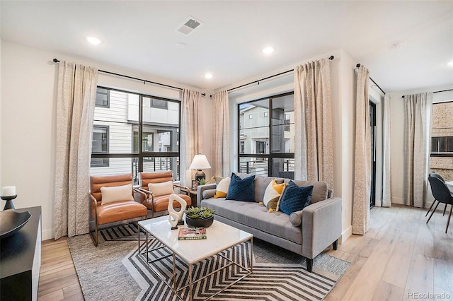 living room with light hardwood / wood-style floors