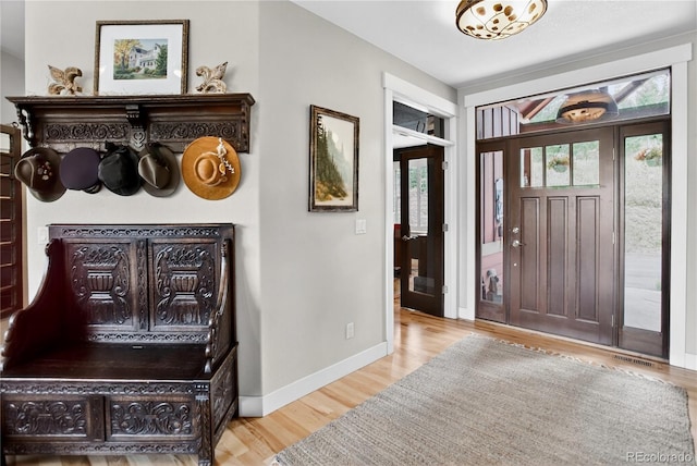 31189 Manitoba Dr, Evergreen, CO 80439 - foyer featuring healthy amount of natural light and wood finished floors