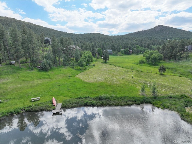 31189 Manitoba Dr, Evergreen, CO 80439 - mountain view with a heavily wooded area and a nearby body of water