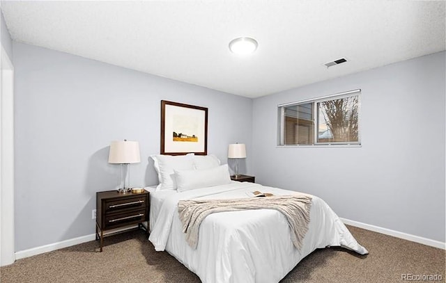 bedroom with carpet flooring and baseboards
