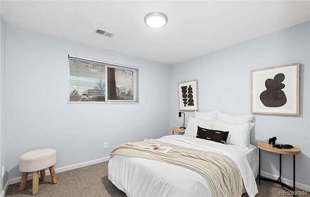 bedroom featuring carpet and baseboards