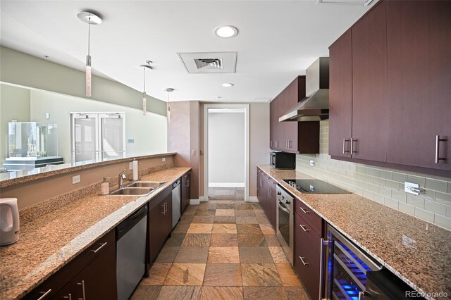 kitchen featuring stainless steel appliances, decorative backsplash, a sink, wall chimney range hood, and beverage cooler