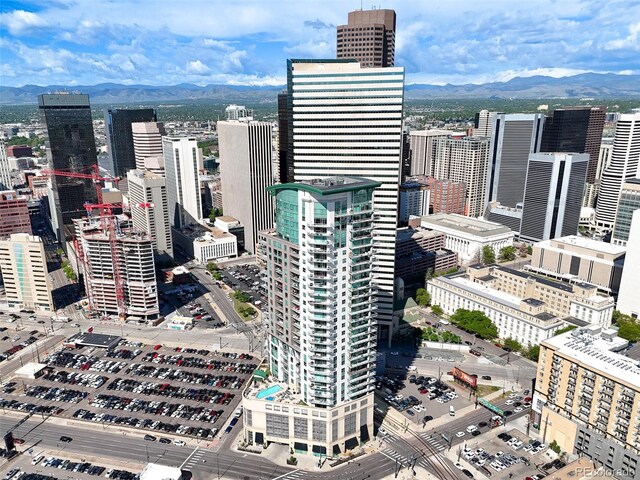 property's view of city with a mountain view