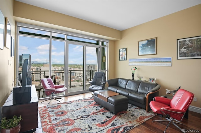 living room featuring baseboards and wood finished floors