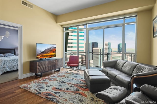 2001 Lincoln St Unit 2420, Denver, CO 80202 - living room with plenty of natural light, wood finished floors, and baseboards