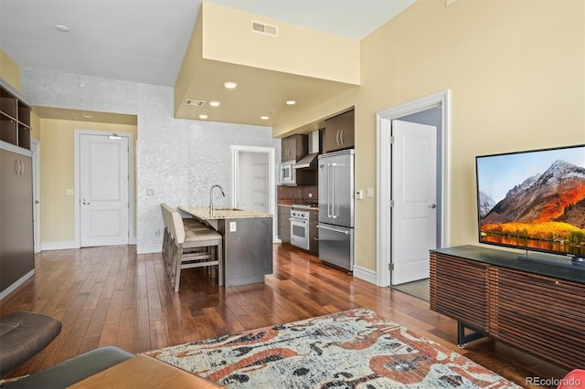 2001 Lincoln St Unit 2420, Denver, CO 80202 - living area with dark wood finished floors, baseboards, and recessed lighting