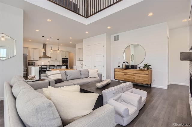 living room featuring dark wood-type flooring