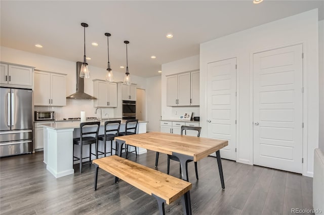 dining space featuring dark hardwood / wood-style flooring