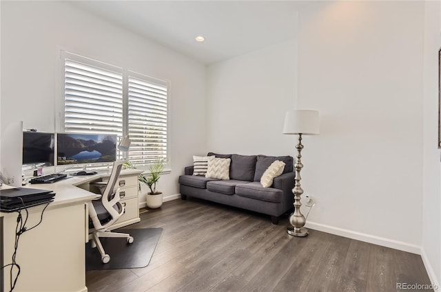 office space with dark wood-type flooring