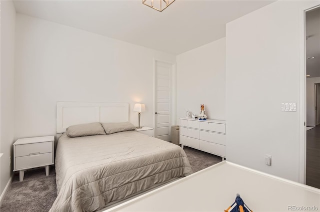 bedroom featuring dark carpet