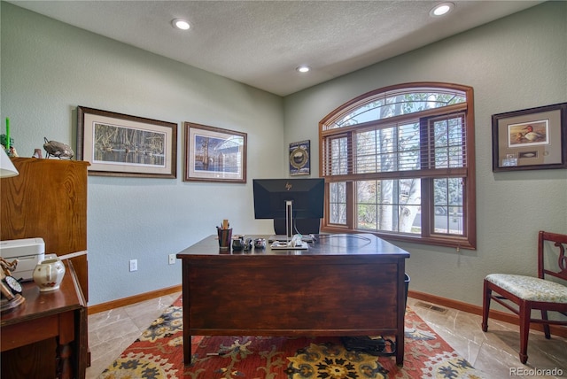 home office featuring recessed lighting, a textured ceiling, visible vents, and plenty of natural light