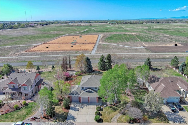 birds eye view of property with a rural view