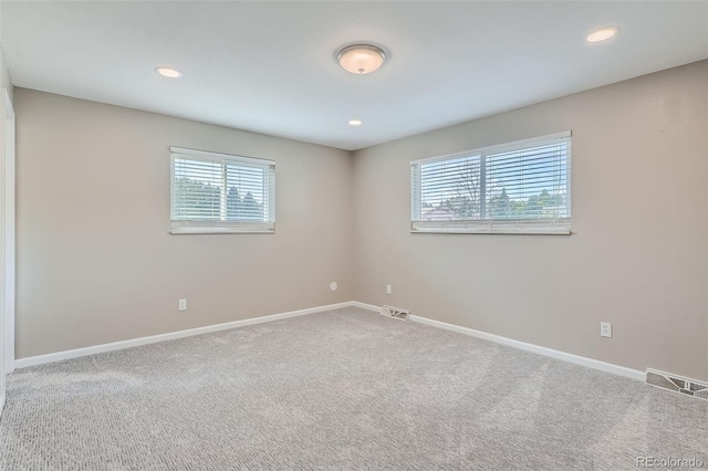 empty room with carpet flooring