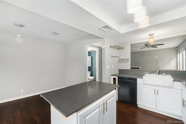 kitchen with black dishwasher, a sink, ceiling fan, white cabinetry, and dark wood finished floors