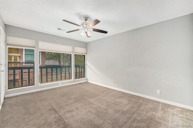 unfurnished room featuring a ceiling fan, carpet flooring, a textured ceiling, and baseboards