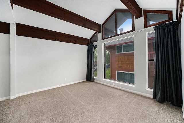 carpeted spare room featuring baseboards