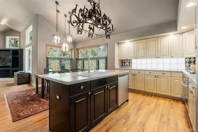 474 Silbrico Way, Castle Rock, CO 80108 - kitchen with dishwasher, light countertops, light wood-style floors, and vaulted ceiling