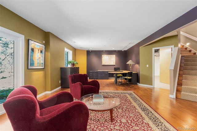 474 Silbrico Way, Castle Rock, CO 80108 - living room featuring wood finished floors, stairway, baseboards, and a desk