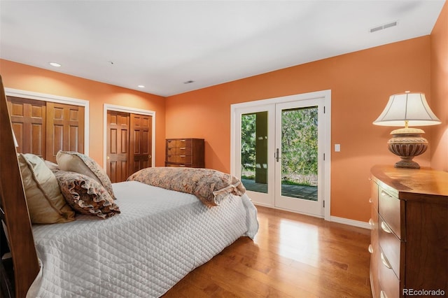 474 Silbrico Way, Castle Rock, CO 80108 - bedroom with access to outside, light wood finished floors, baseboards, recessed lighting, and multiple closets