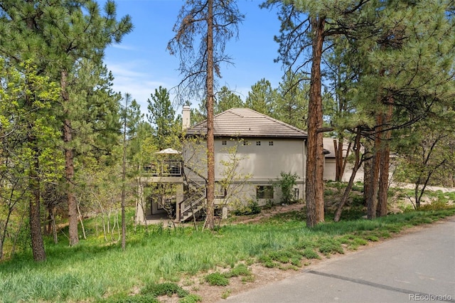 474 Silbrico Way, Castle Rock, CO 80108 - view of property exterior featuring a chimney and stairway