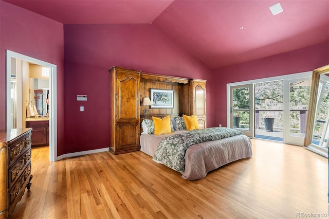 474 Silbrico Way, Castle Rock, CO 80108 - bedroom with light wood-style floors, multiple windows, vaulted ceiling, access to exterior, and ensuite bath