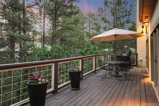 474 Silbrico Way, Castle Rock, CO 80108 - deck at dusk featuring outdoor dining space