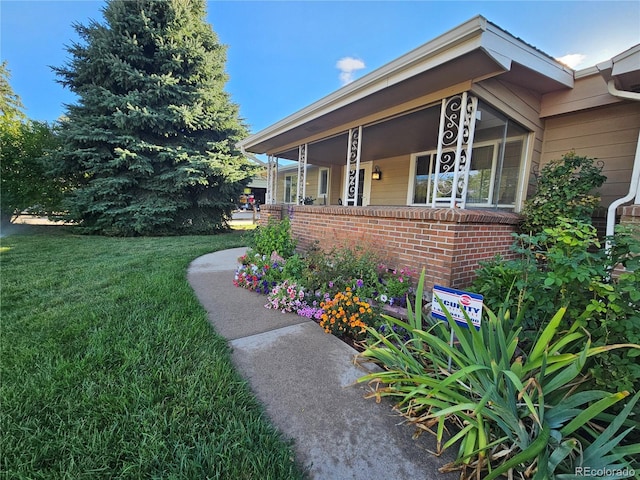 view of home's exterior with a yard