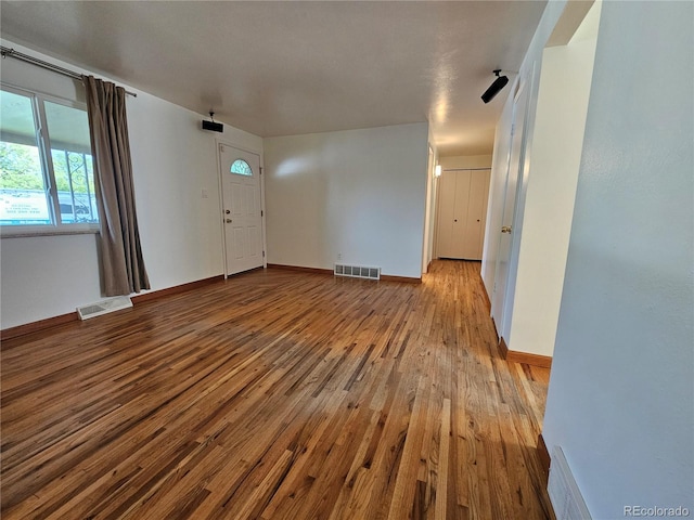 unfurnished living room with light wood-type flooring