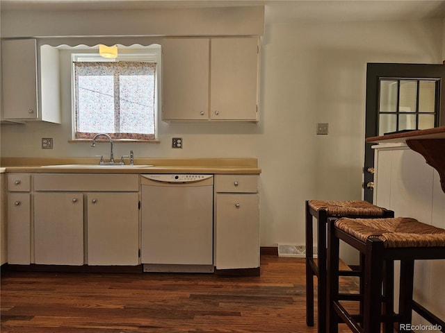 kitchen featuring white cabinetry, sink, dark hardwood / wood-style floors, and dishwasher