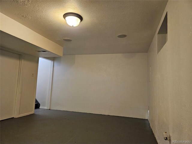 basement with a textured ceiling