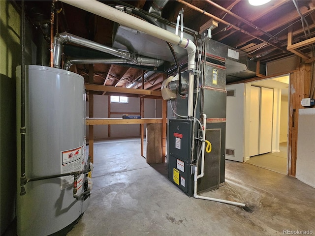 utility room featuring gas water heater and heating unit