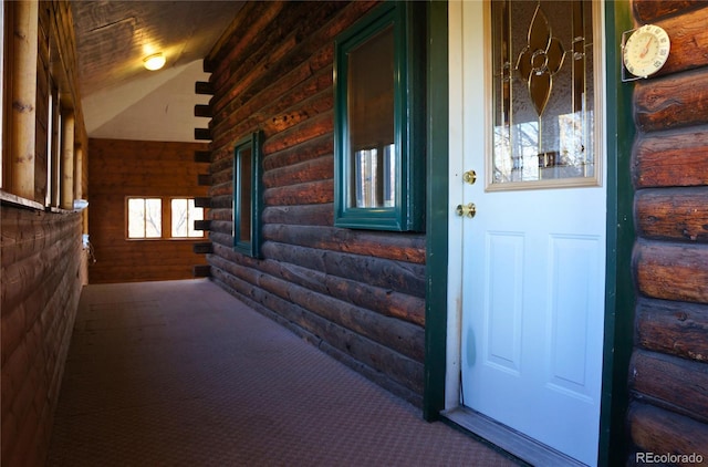 view of exterior entry featuring a porch