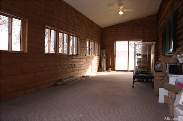 unfurnished sunroom featuring ceiling fan and vaulted ceiling