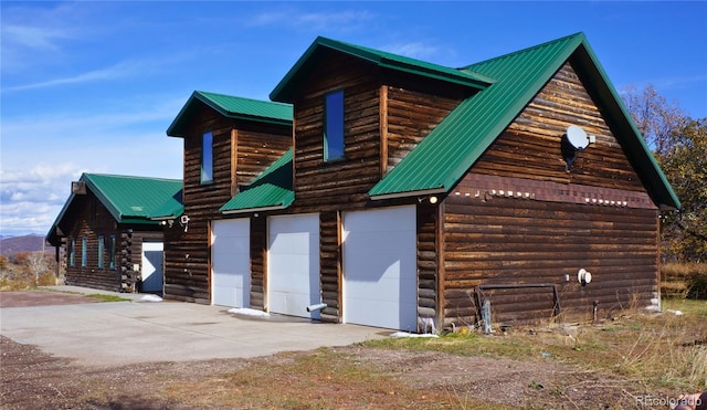 view of property exterior with a garage