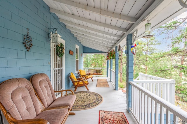 wooden terrace with a porch