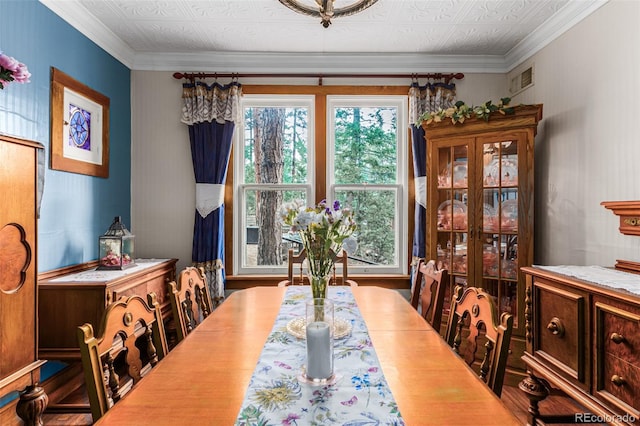 dining room featuring an ornate ceiling and ornamental molding