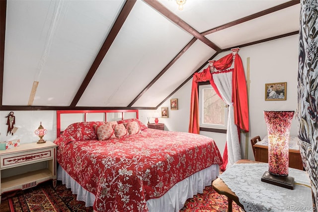 bedroom with lofted ceiling with beams